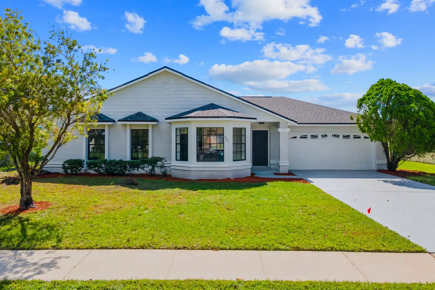 A Central Florida home with a bright lawn and blue sky